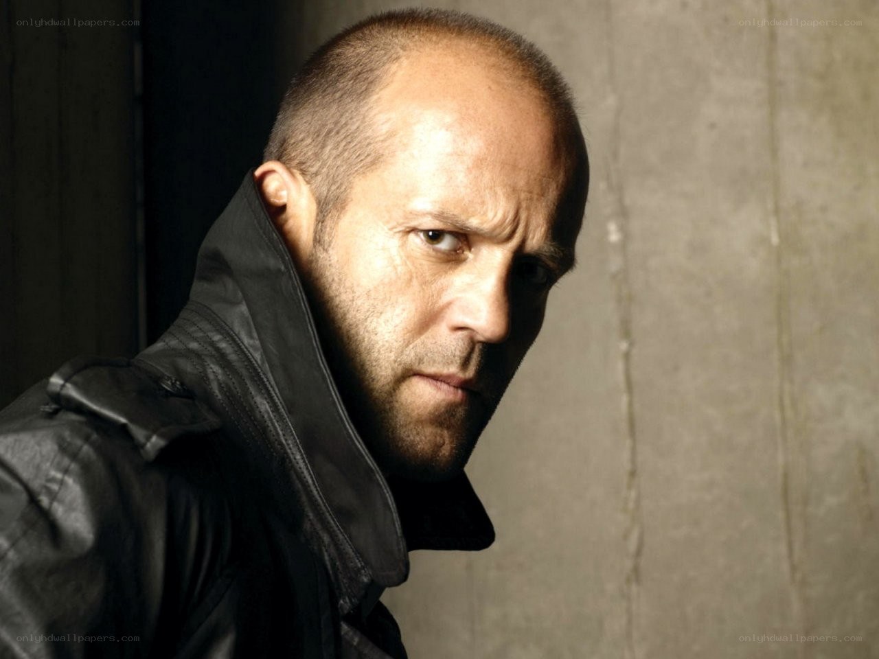 Jason Statham in a black jacket