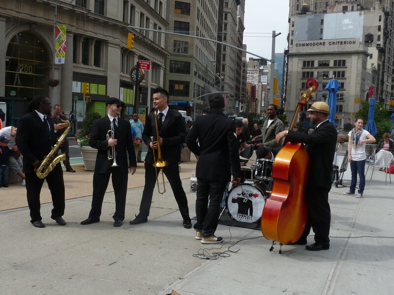 Jazz band performs on city street