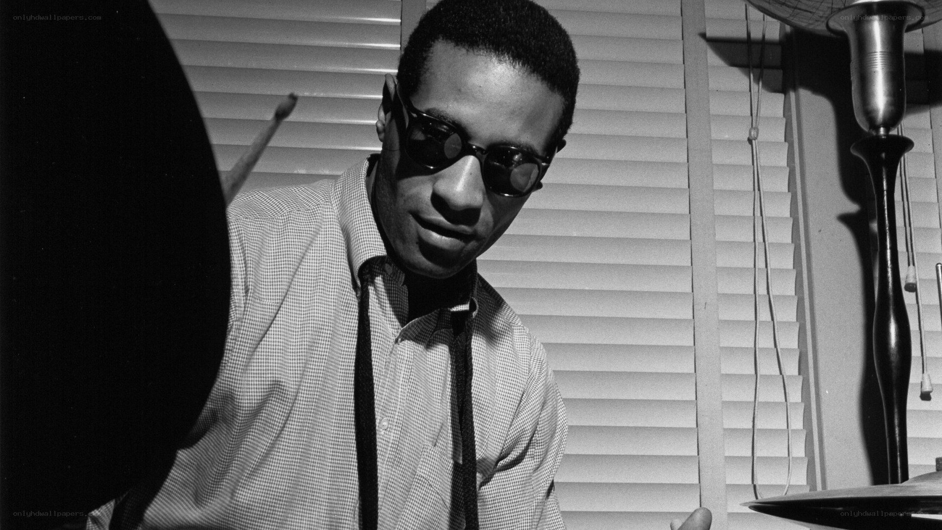 jazz drummer in sunglasses