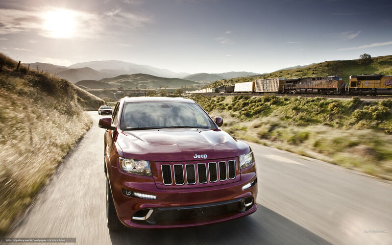 Jeep driving on a scenic road