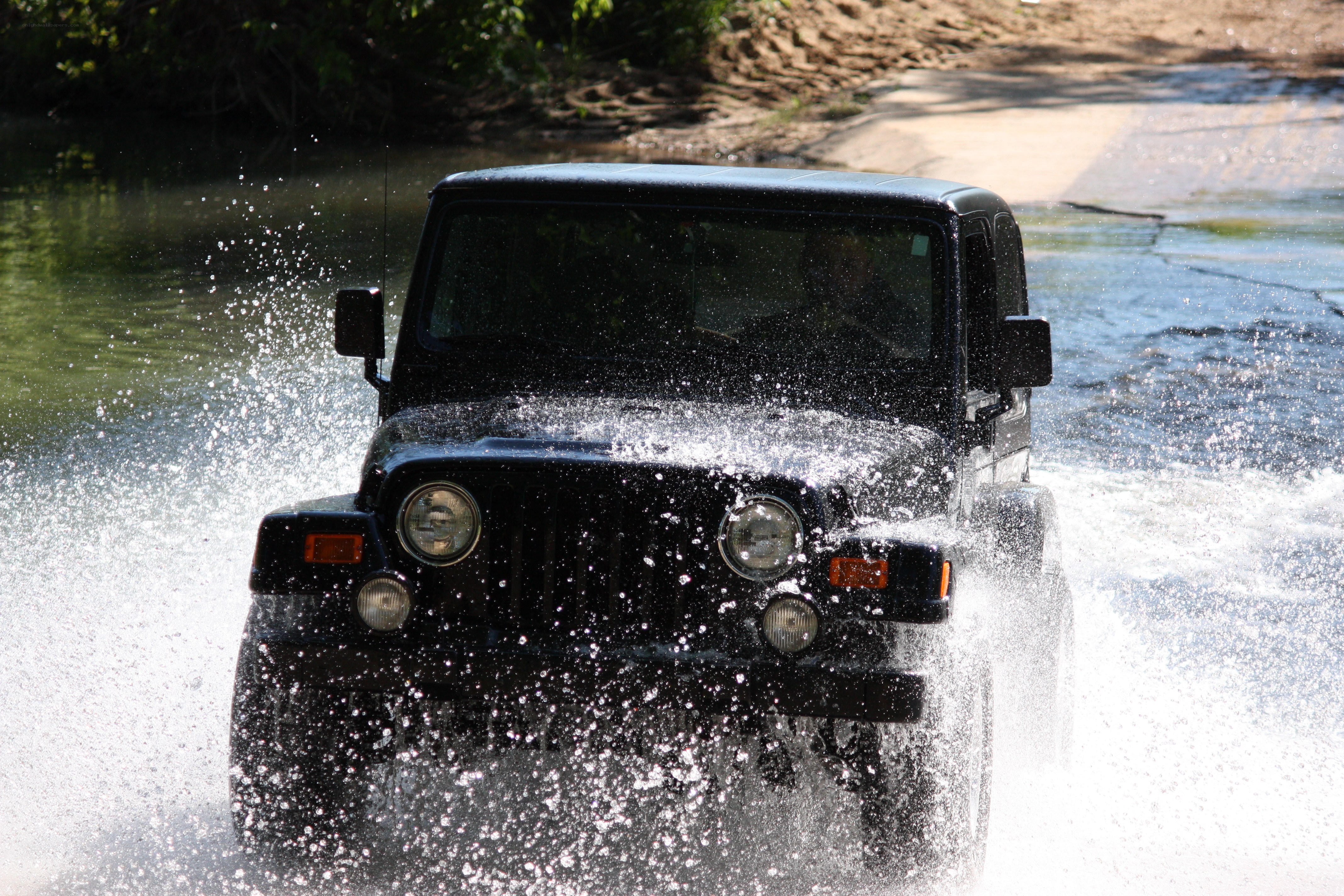 Jeep driving through water