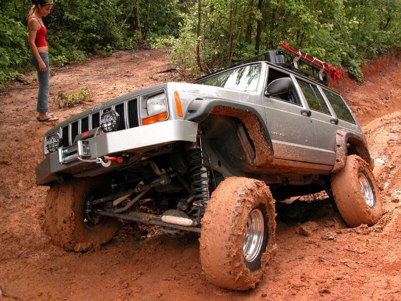 Jeep navigating muddy terrain