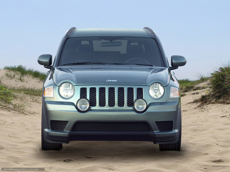 Jeep on a sandy dune