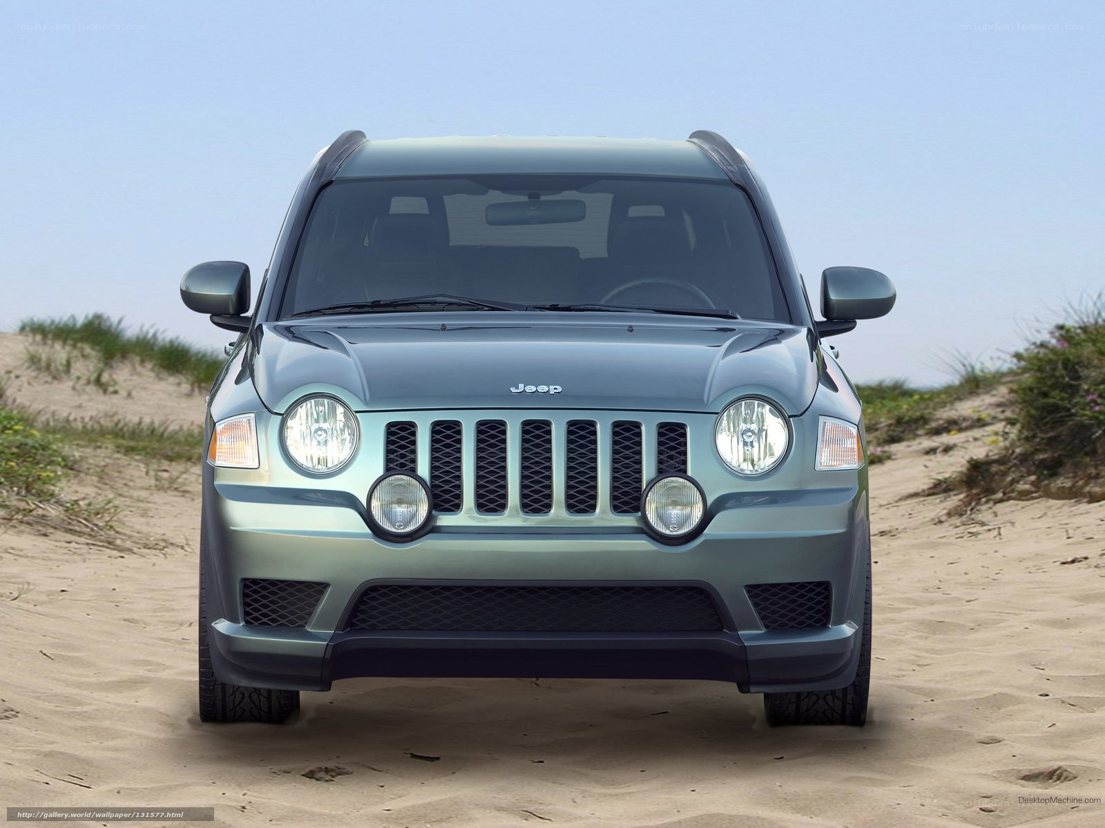 Jeep on a sandy dune