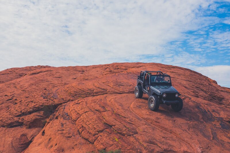 Jeep on red rock formation