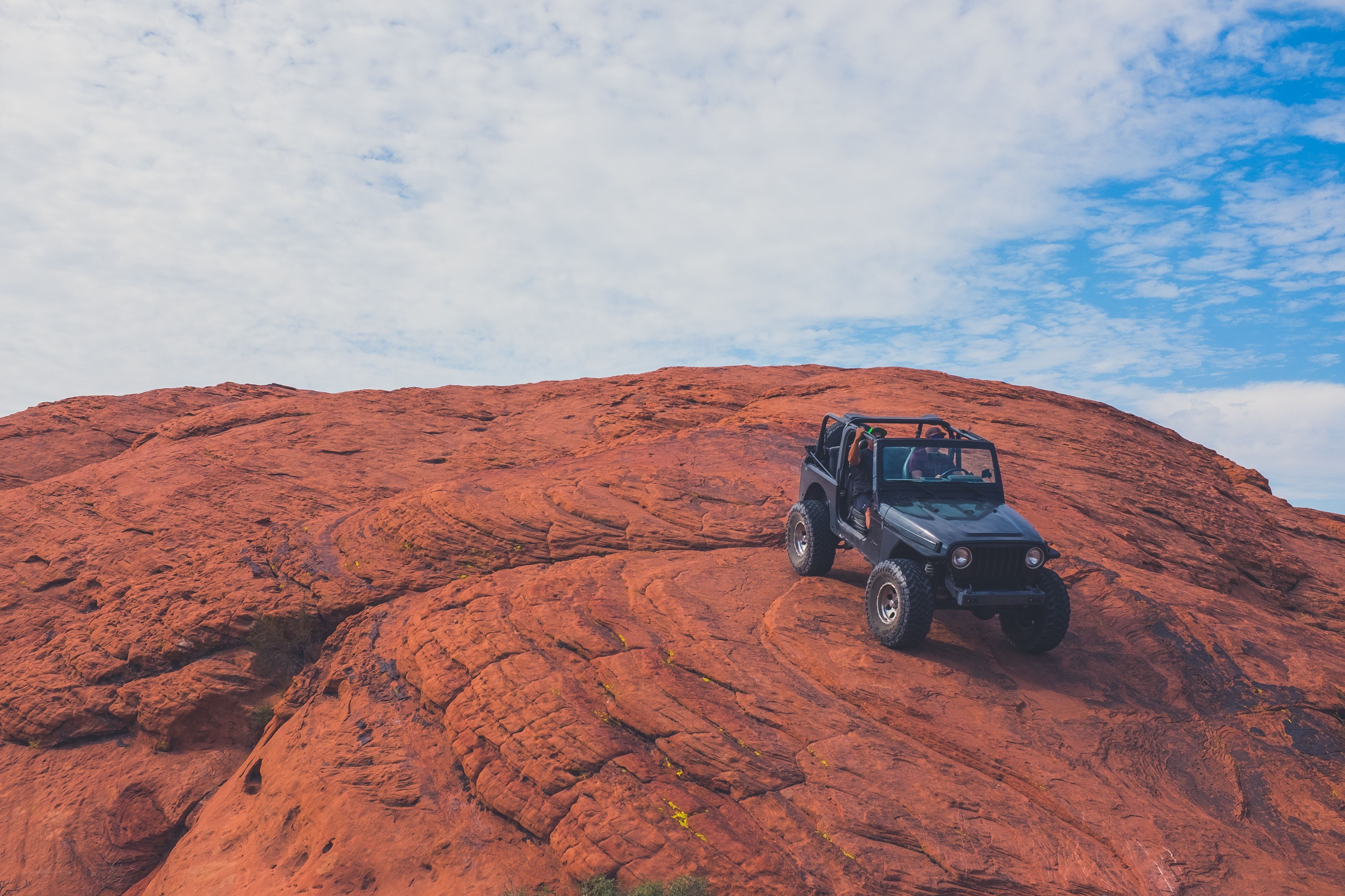 Jeep on red rock formation
