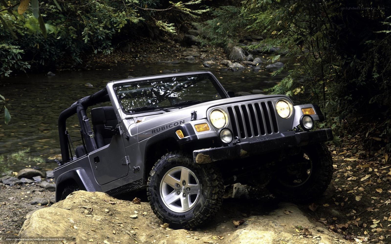 Jeep Rubicon in forest stream
