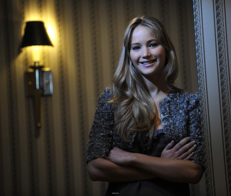 Jennifer Lawrence smiling in a room