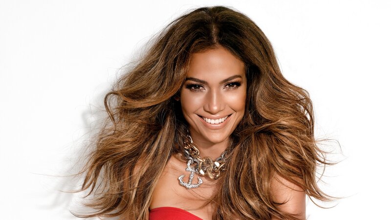Jennifer Lopez smiling in red dress