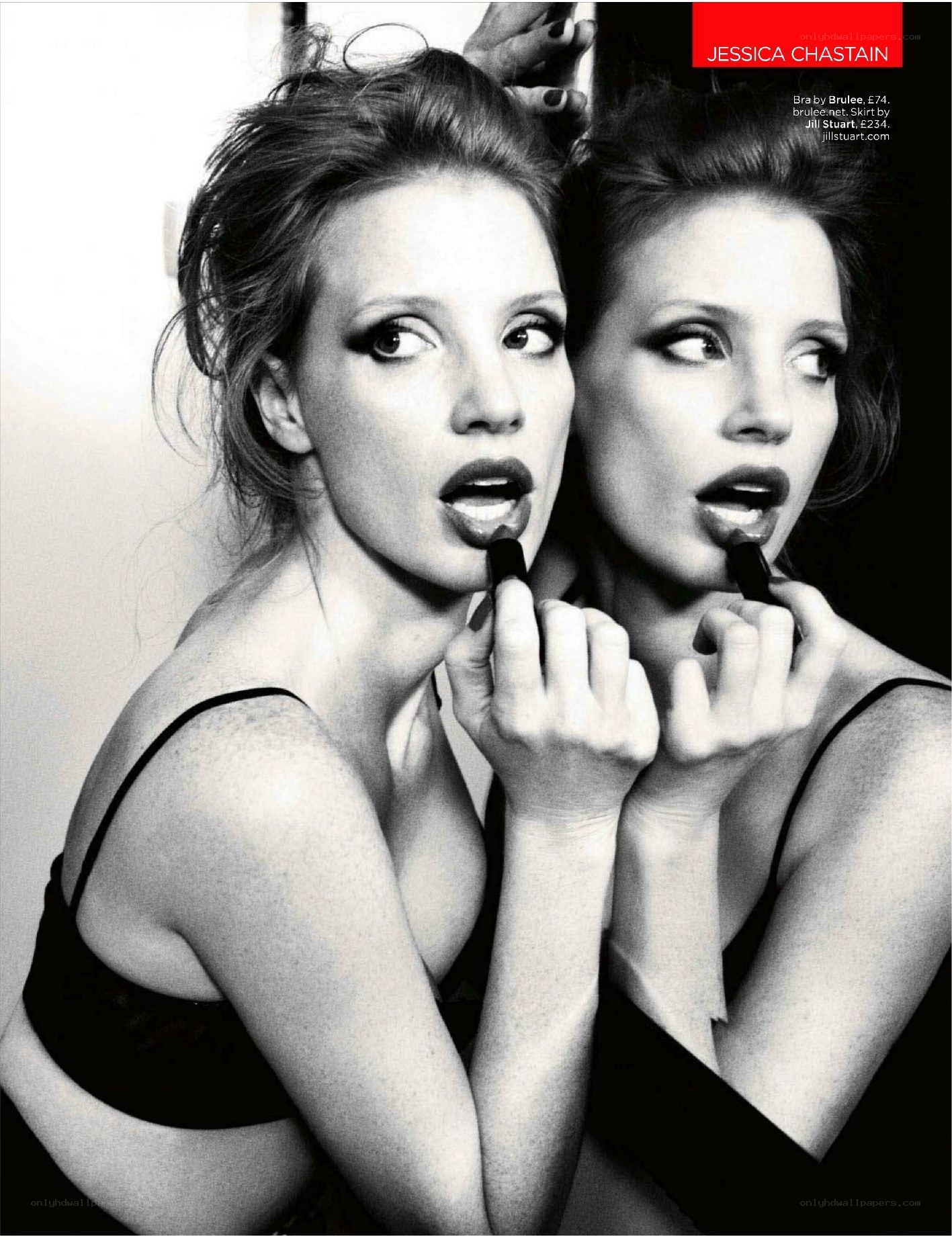 Jessica Chastain applying lipstick