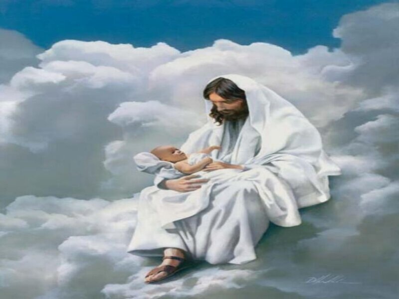 Jesus holding a baby in heaven