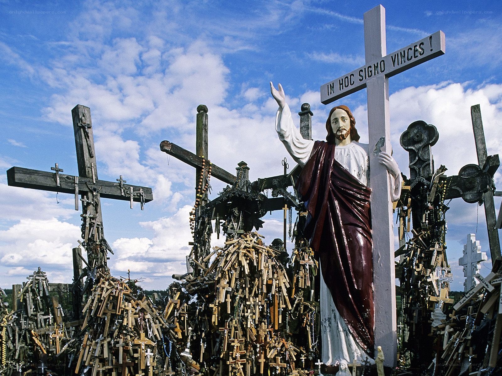 Jesus statue at a cross-covered site
