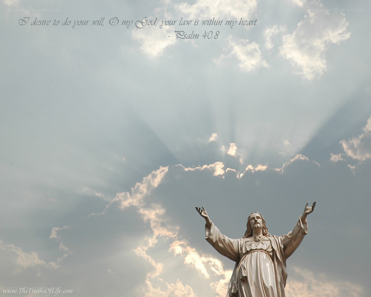 Jesus statue with sunbeams