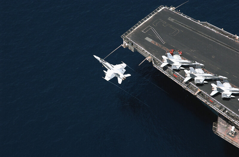 Jet aircraft landing on carrier