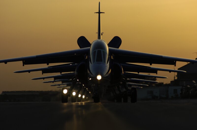 Jet aircraft on runway at dusk