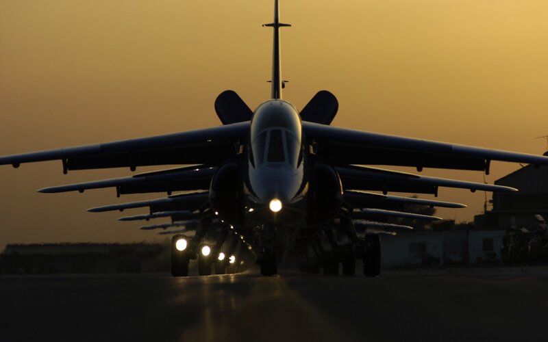 Jet aircraft on runway at dusk