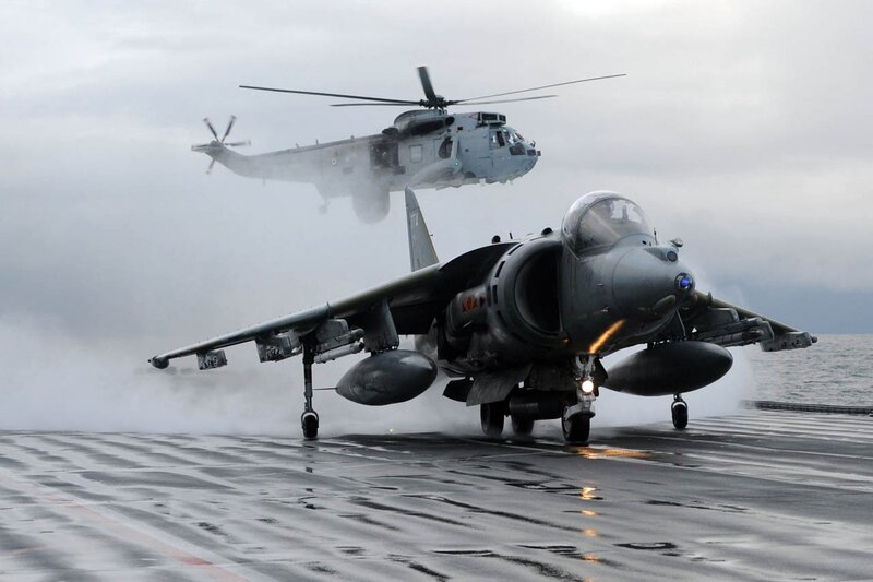 Jet and helicopter on aircraft carrier