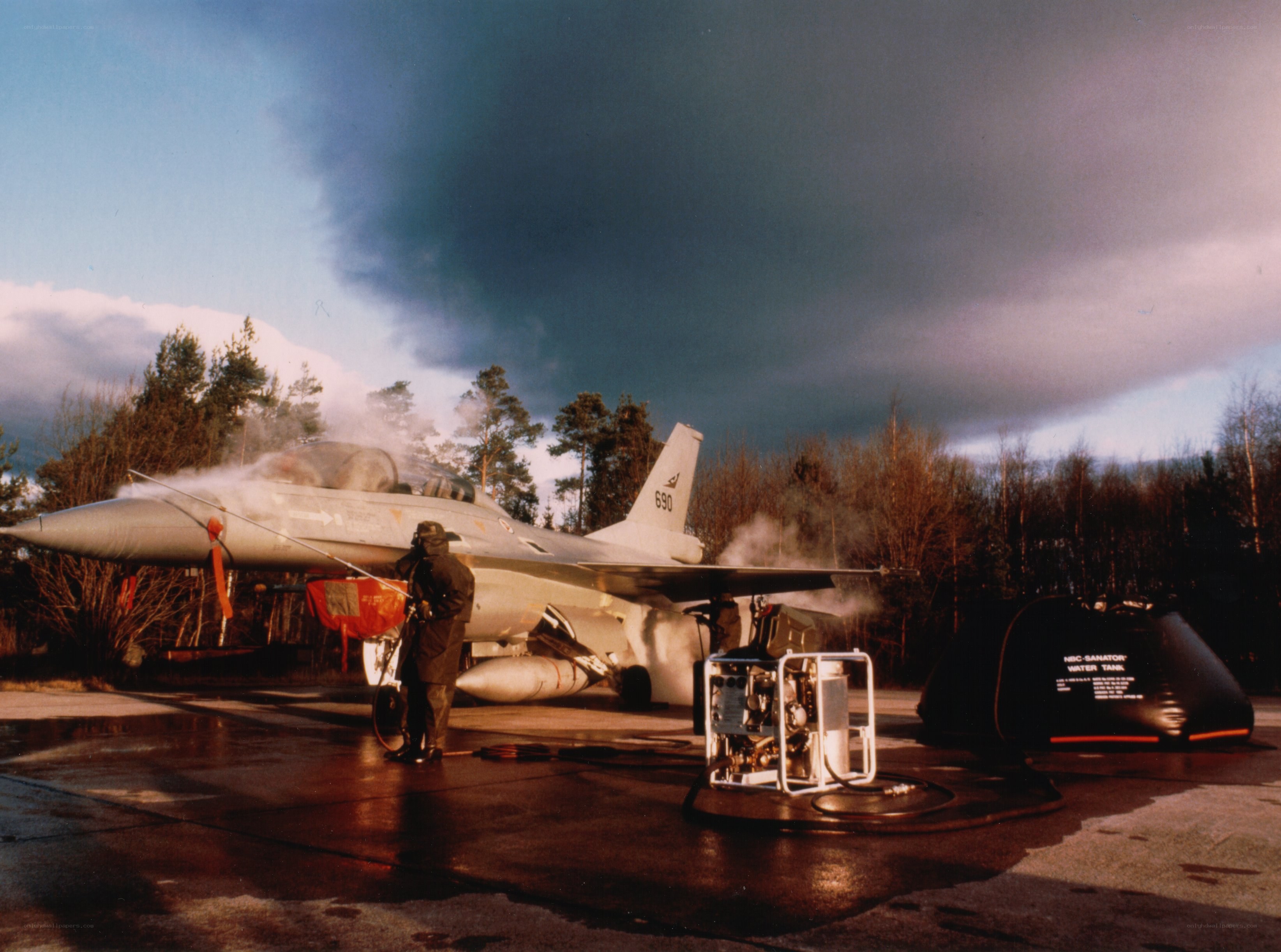 Jet being washed on tarmac