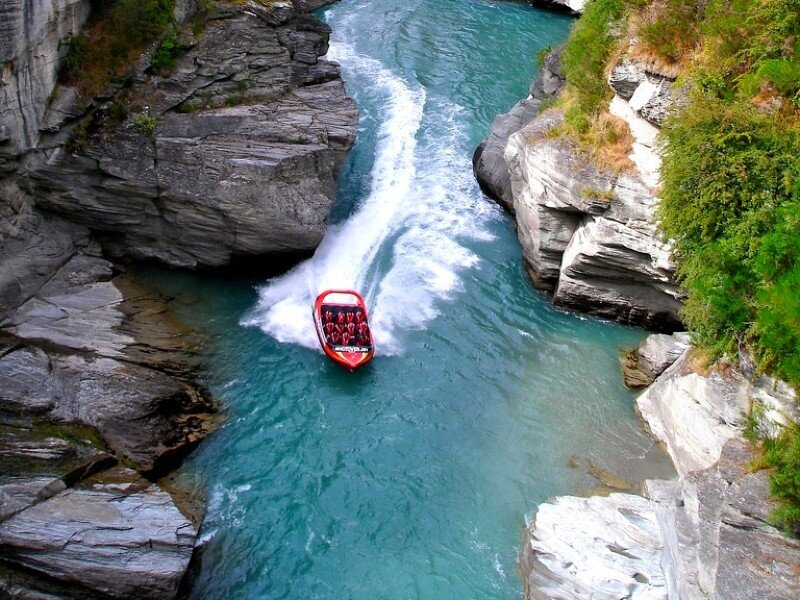 Jet boat in a river canyon