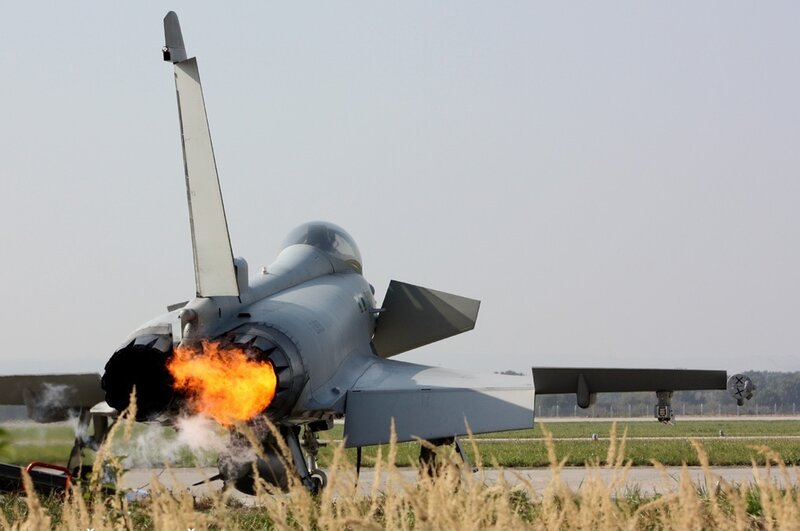 Jet engine afterburner on runway
