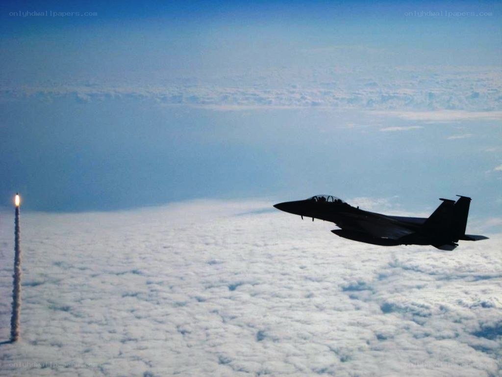 Jet fighter and rocket launch