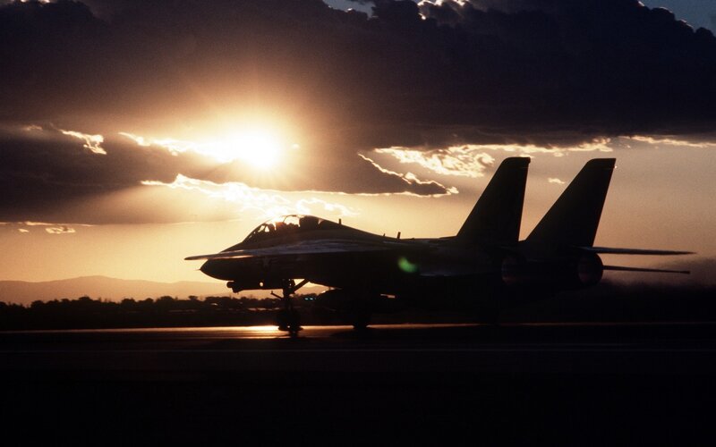 Jet fighter at sunset