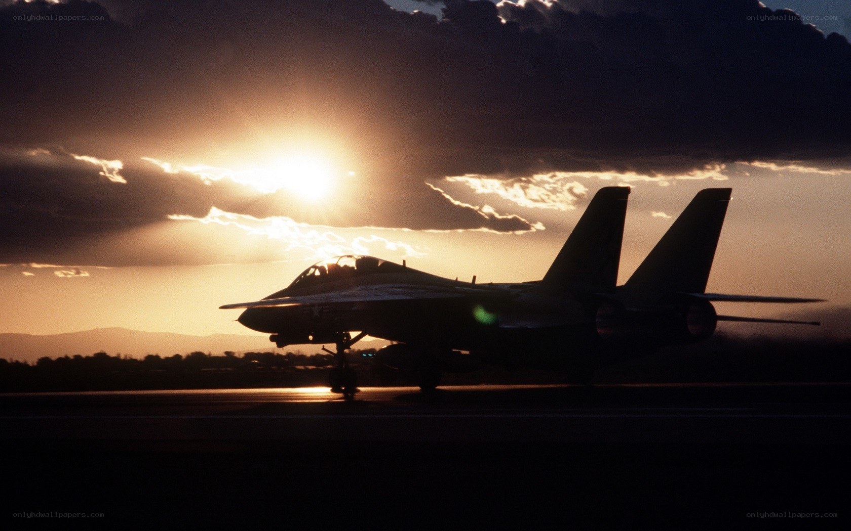 Jet fighter at sunset