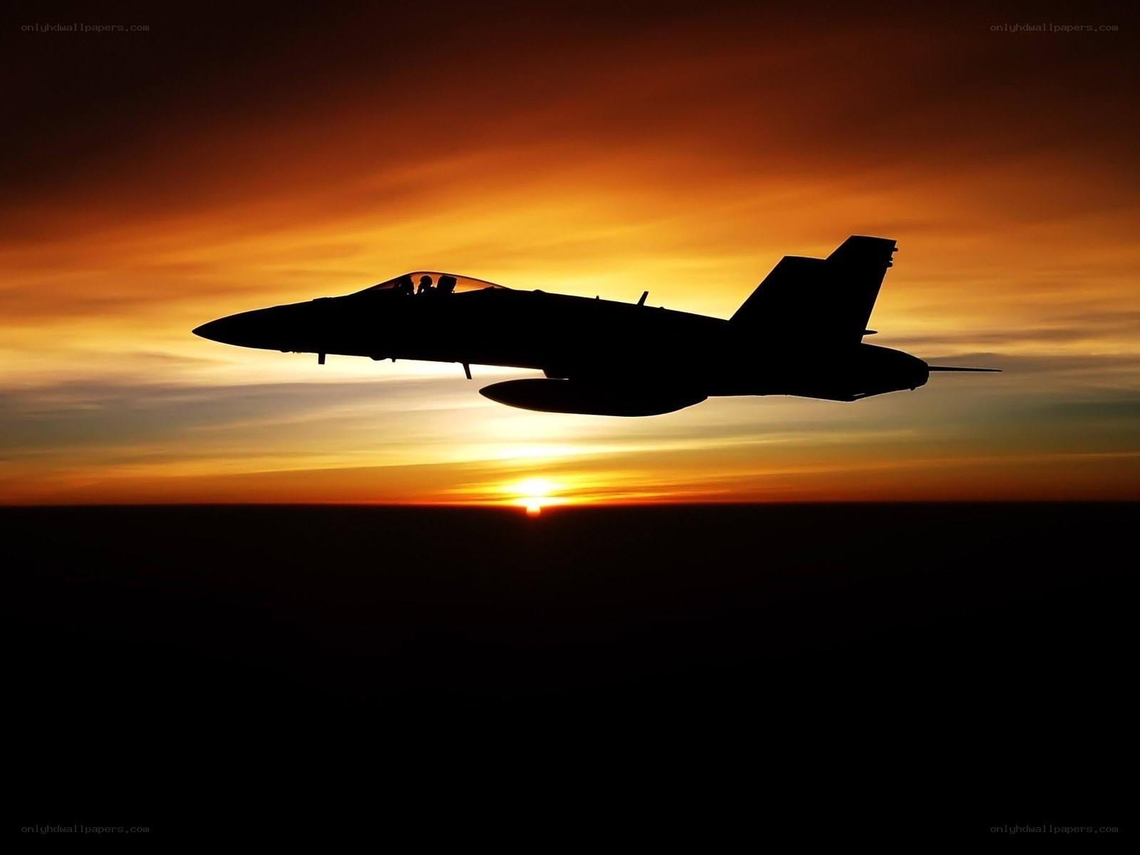 Jet fighter at sunset