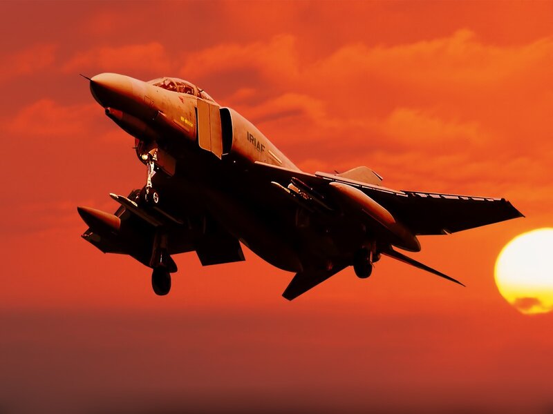 Jet fighter at sunset