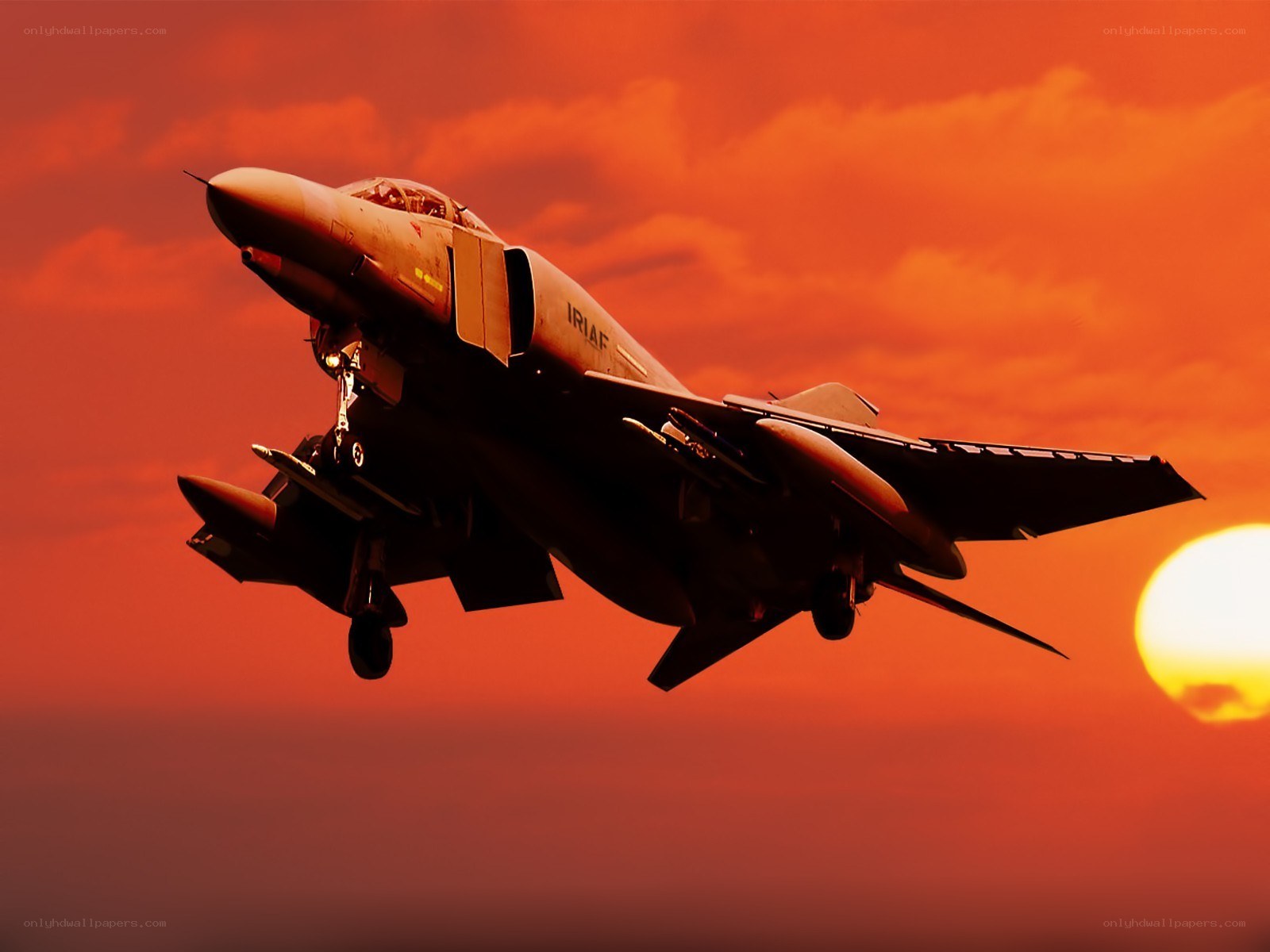 Jet fighter at sunset