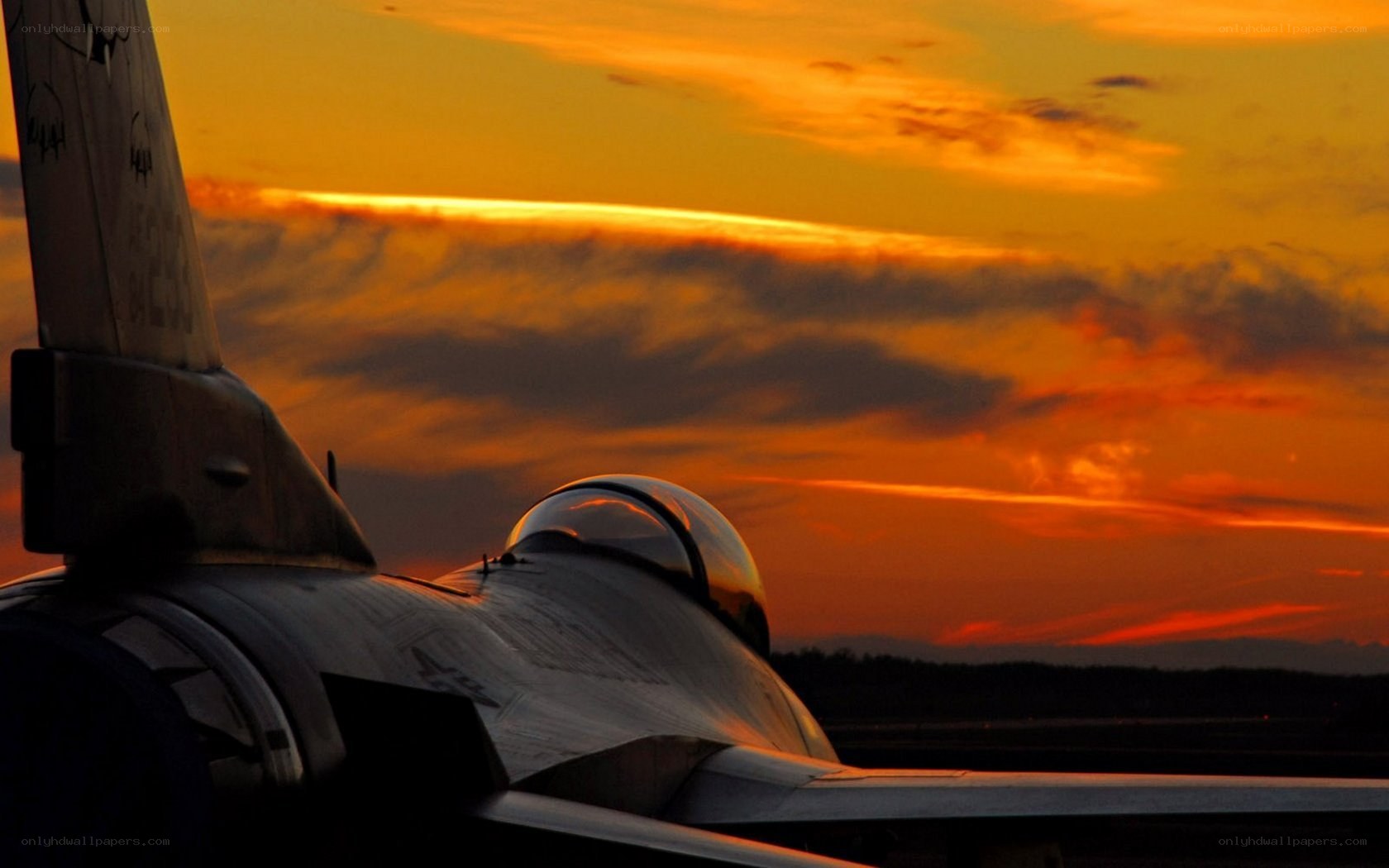 Jet fighter at sunset