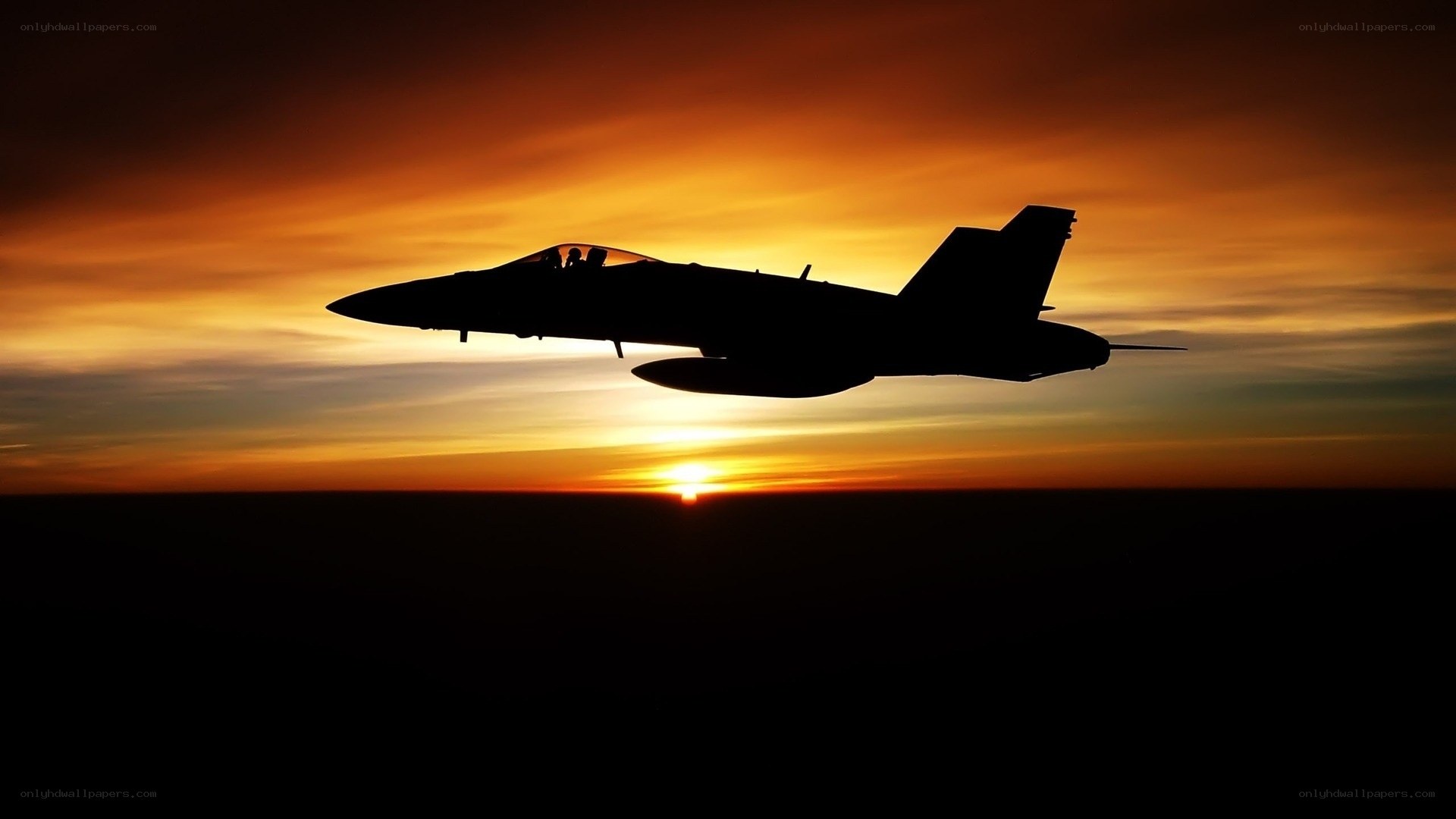 jet fighter at sunset