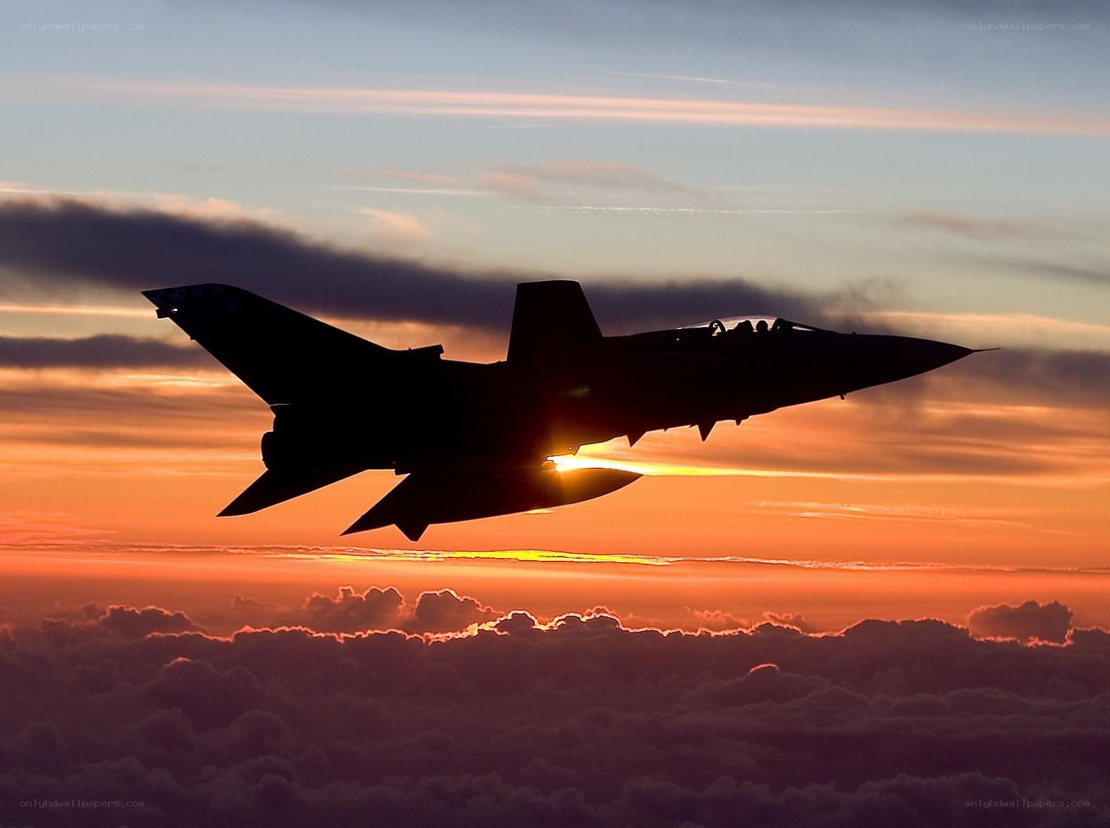 Jet fighter at sunset