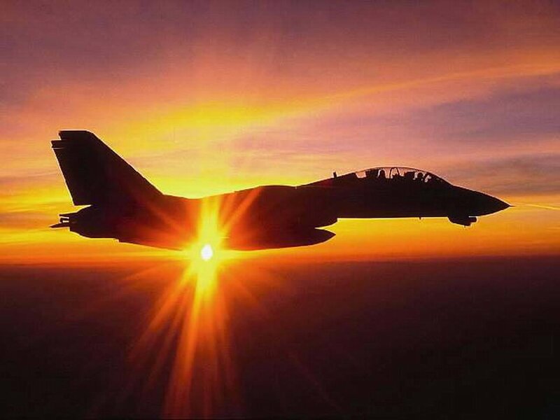 jet fighter at sunset