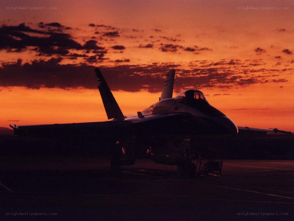 jet fighter at sunset