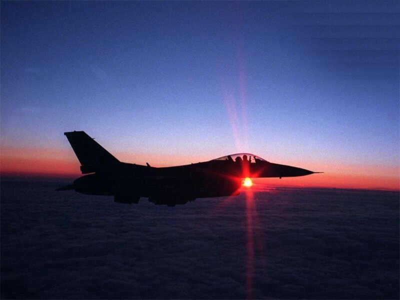 jet fighter at sunset