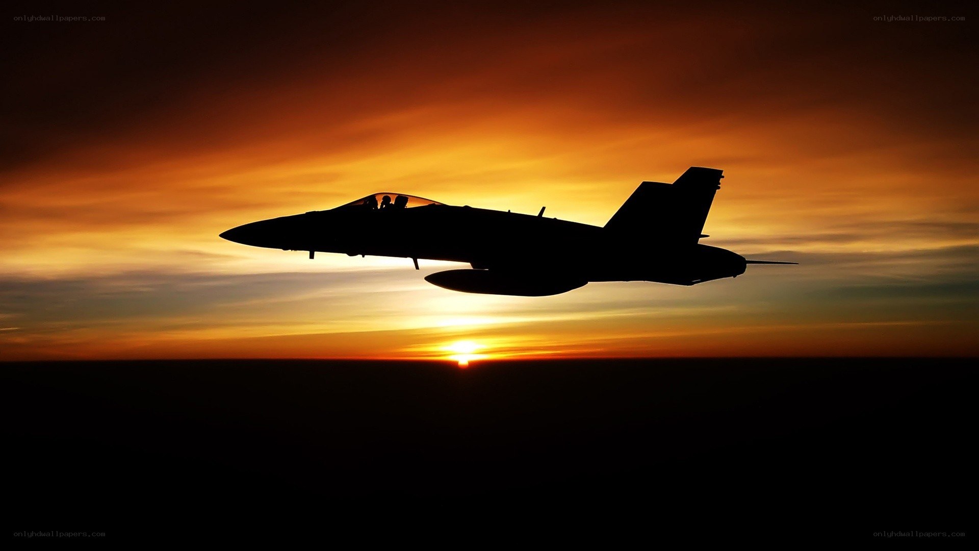 jet fighter at sunset