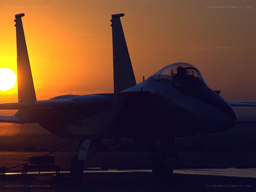 Jet fighter at sunset