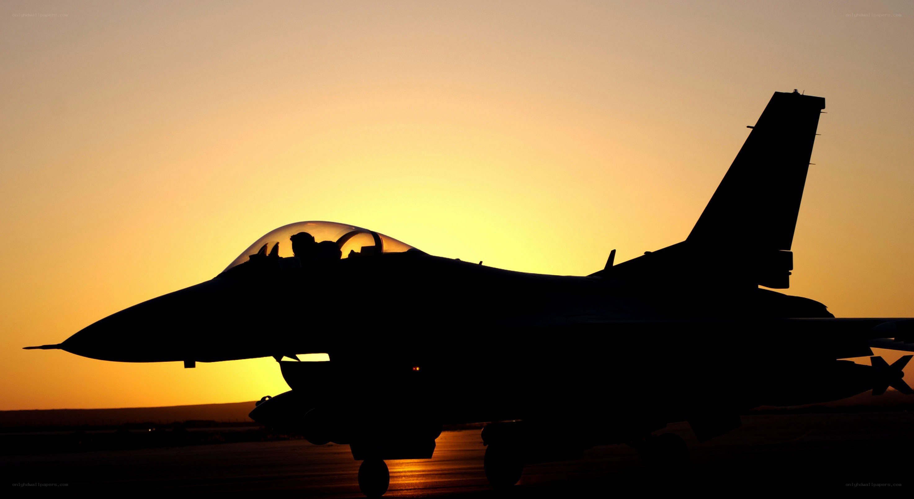 Jet fighter at sunset