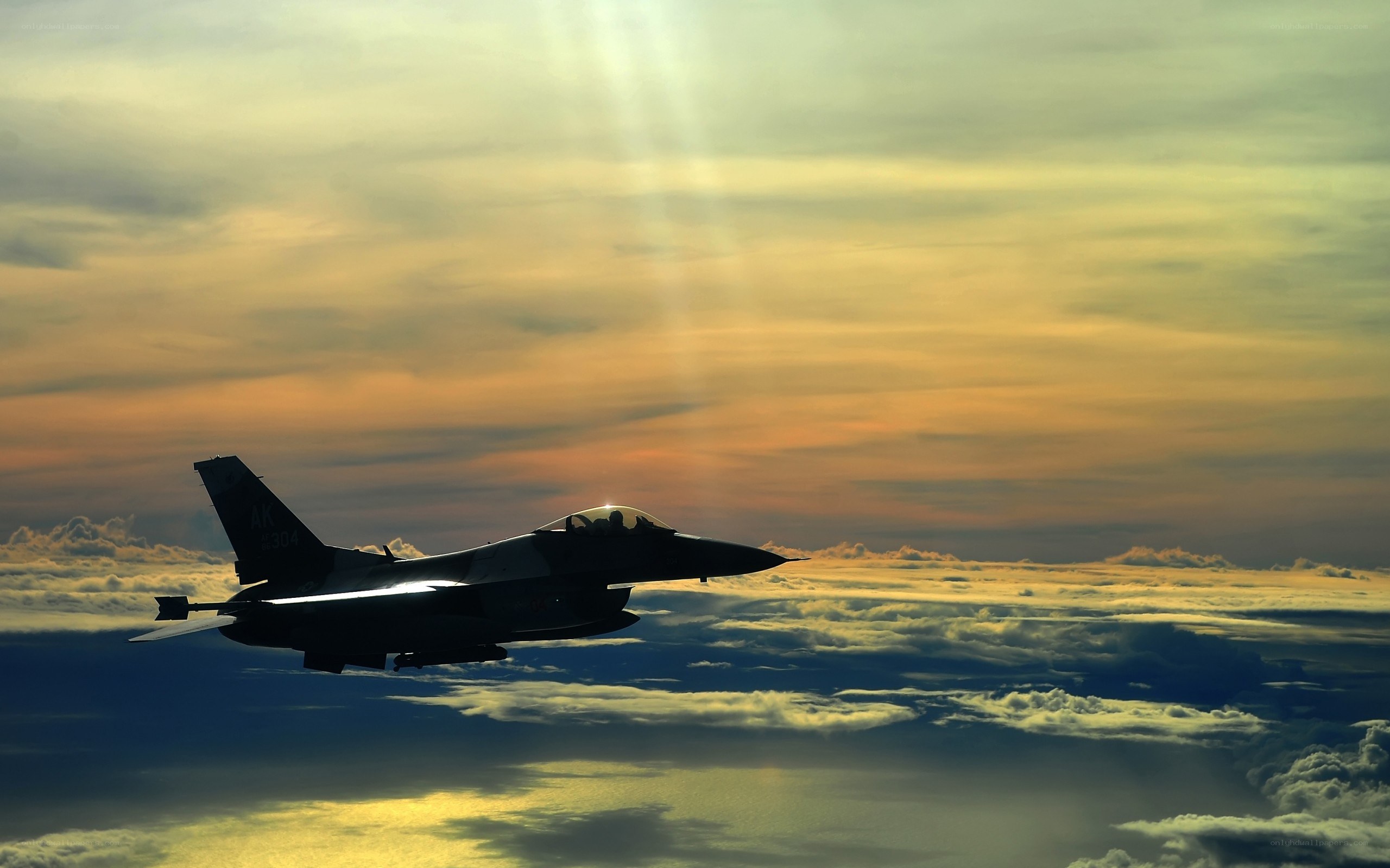 Jet fighter at sunset