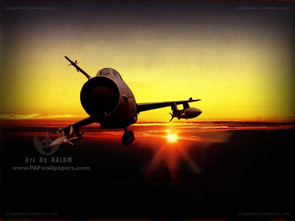 Jet fighter at sunset