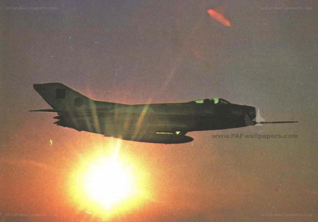 jet fighter at sunset