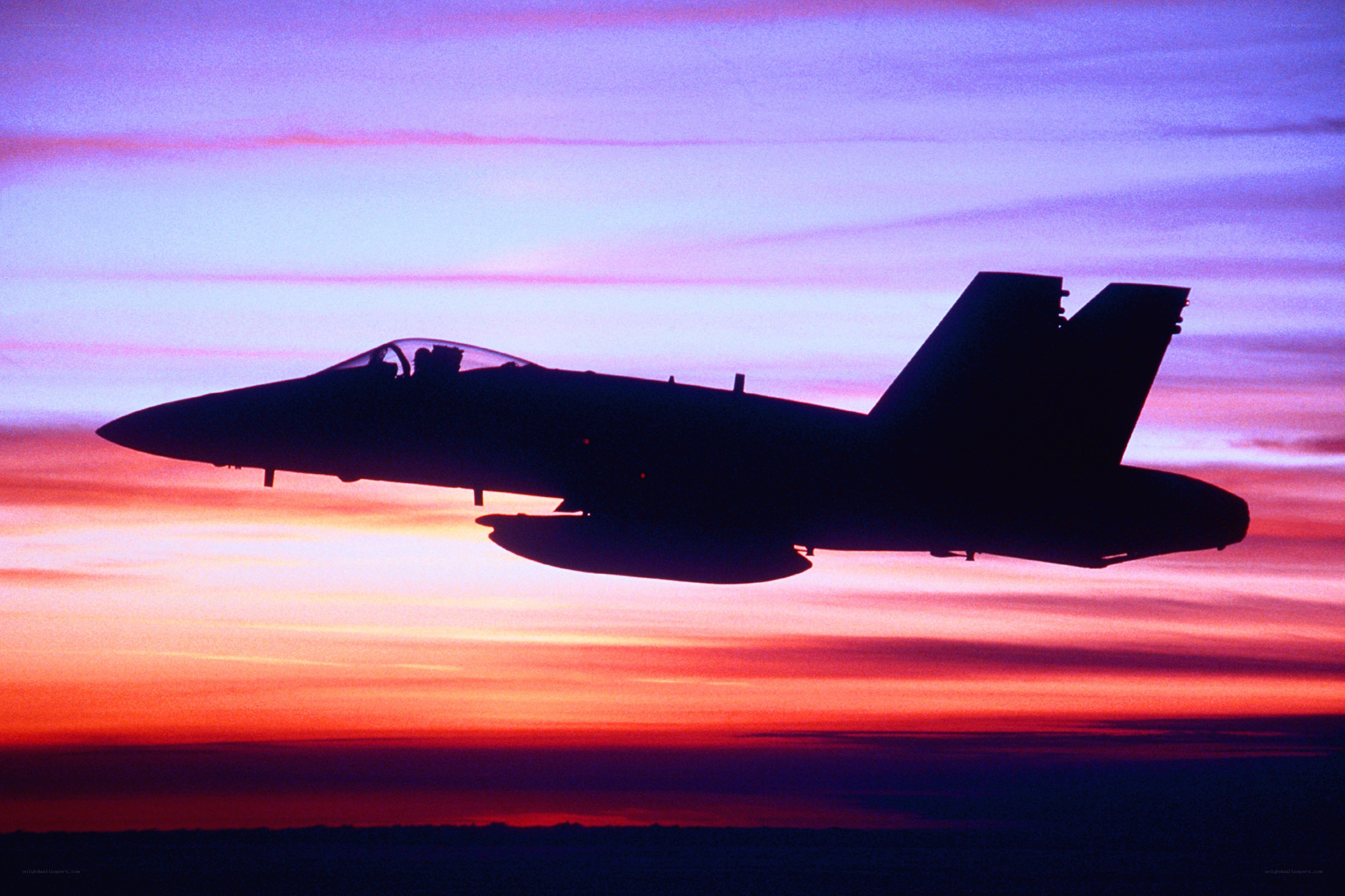 jet fighter at sunset