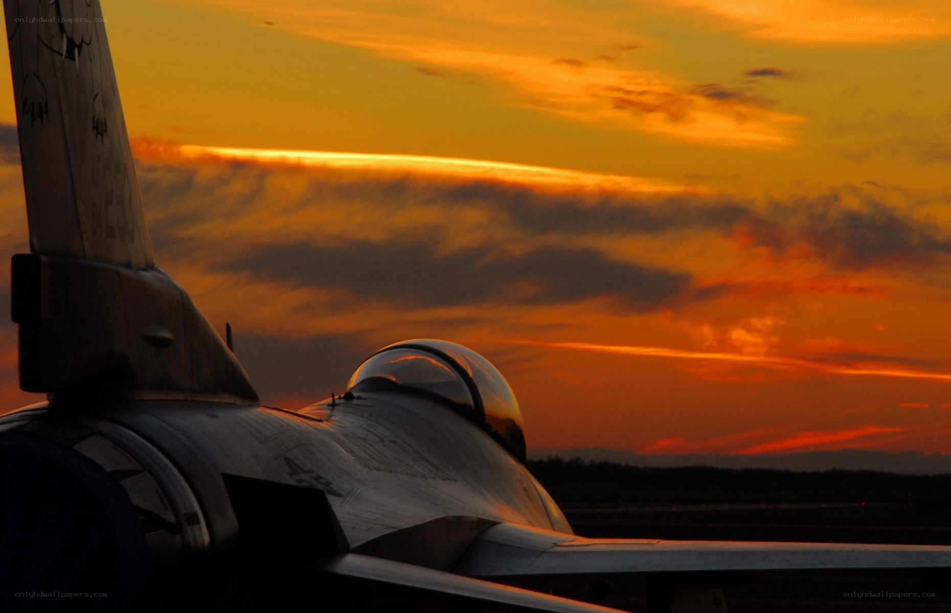 Jet fighter at sunset