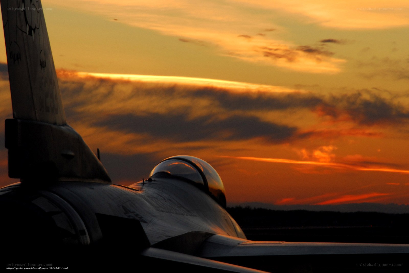 Jet fighter at sunset