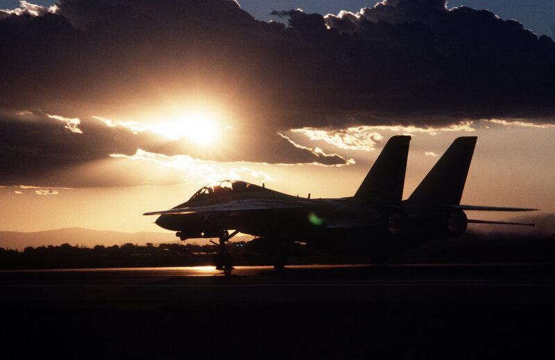 Jet fighter at sunset