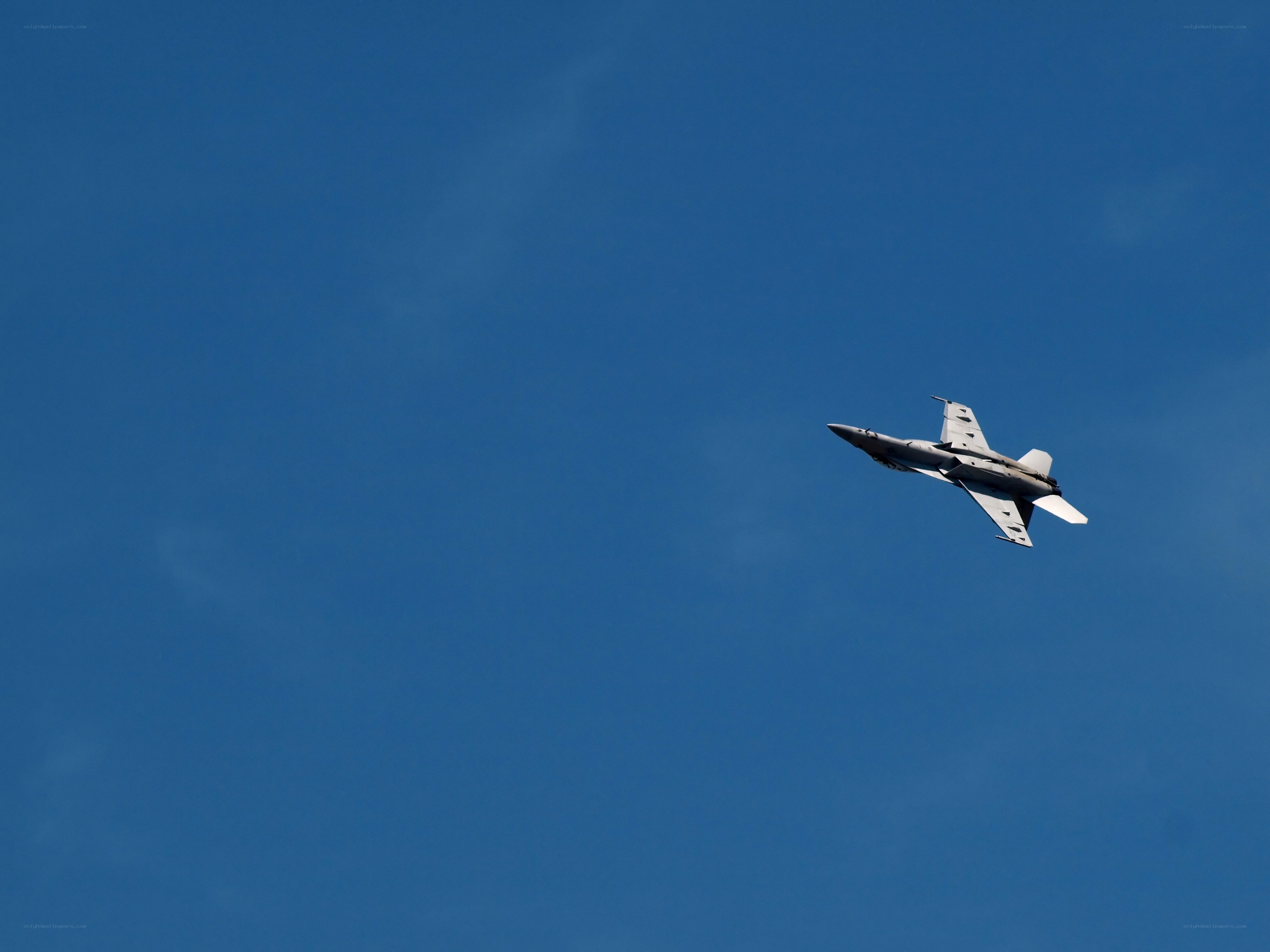 jet fighter in blue sky