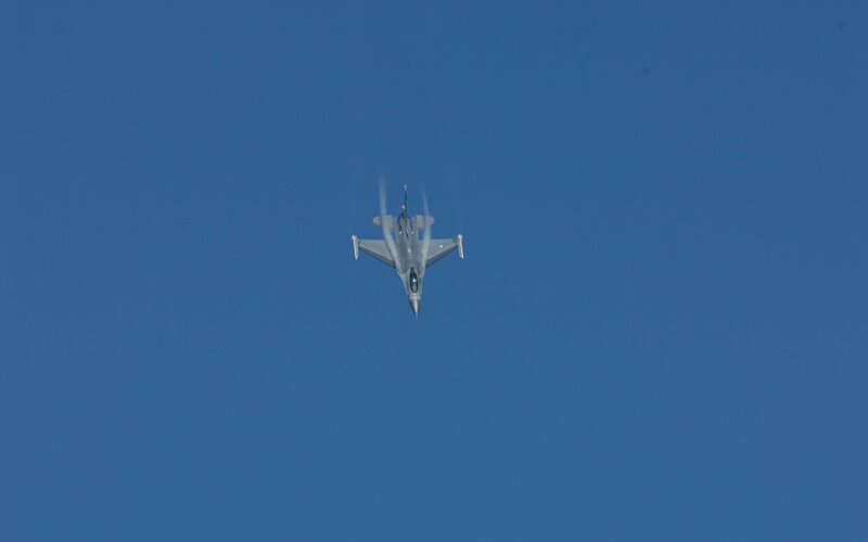 Jet fighter in blue sky