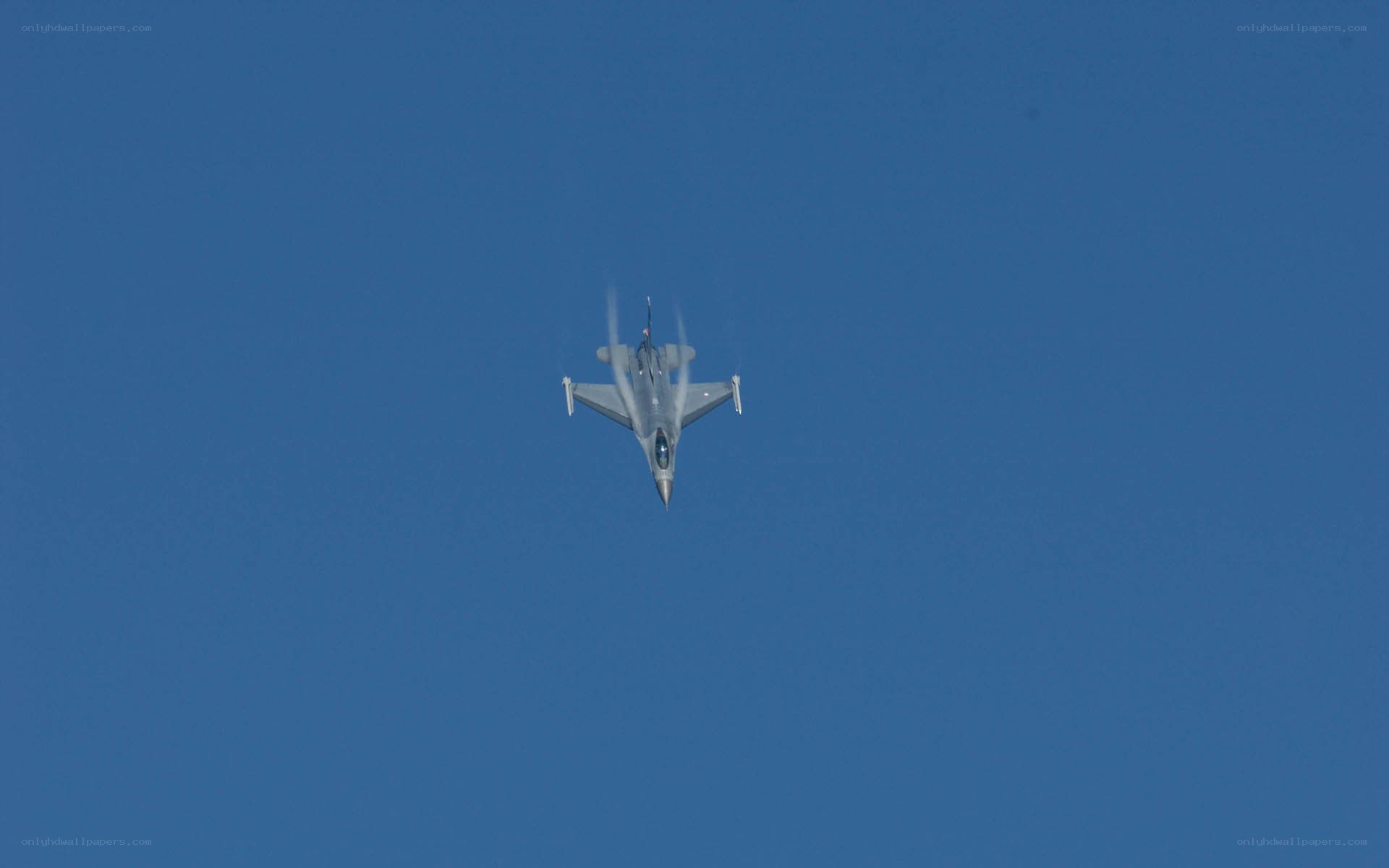 Jet fighter in blue sky