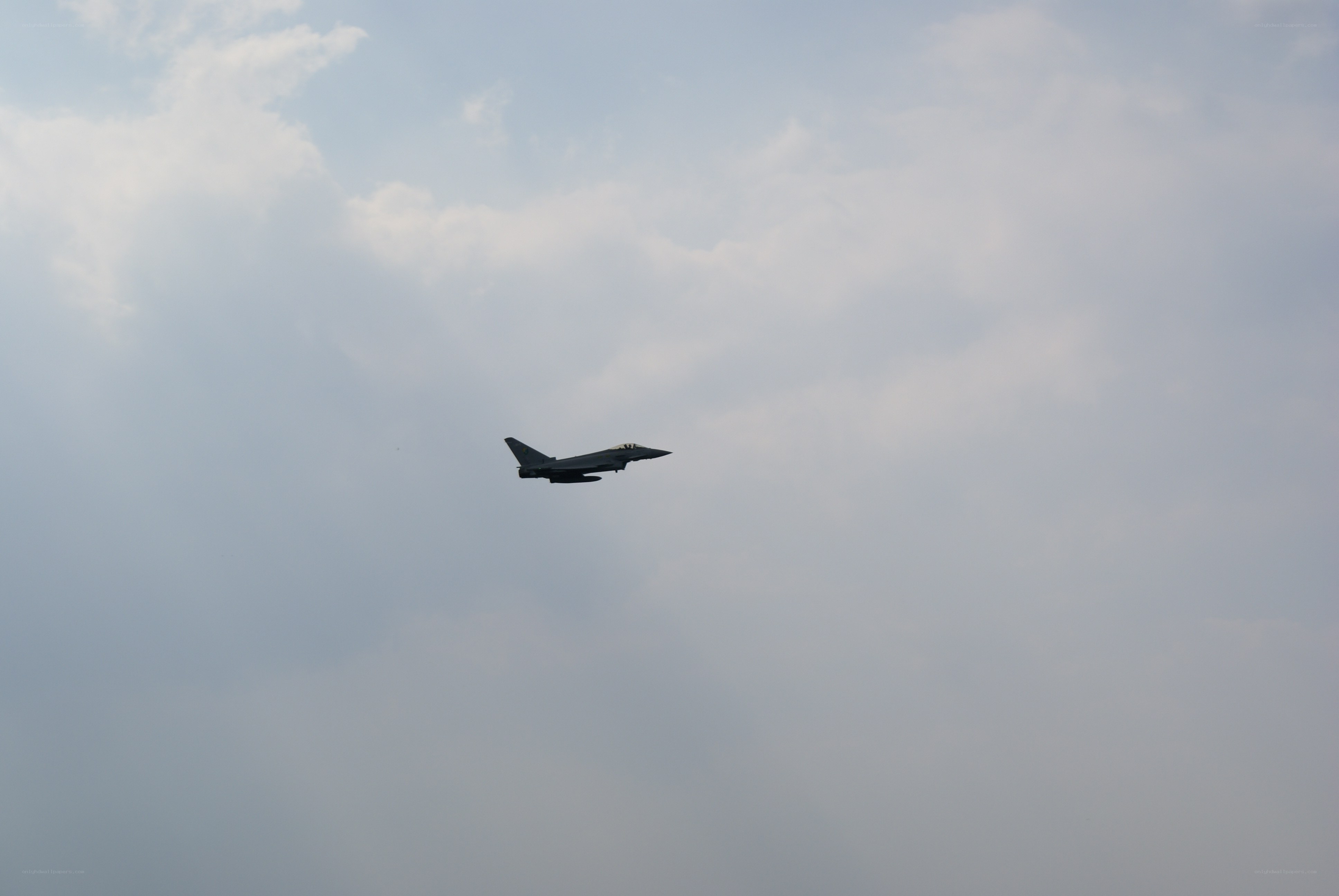 jet fighter in cloudy sky